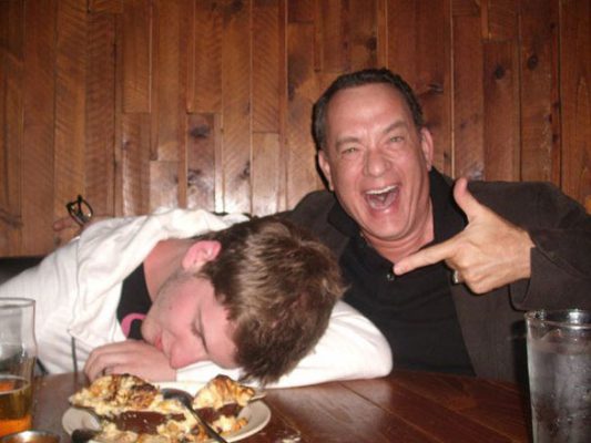 Tom Hanks Takes Odd Photos With Fan Pretending to Be Drunk