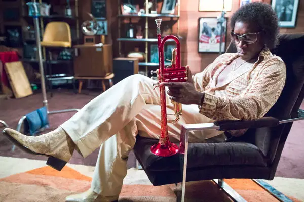 Don Cheadle as Miles Davis