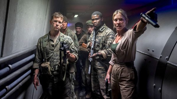 Ryan Kwanter and Tricia Helfer battle dinosaurs in 'Primitive War'