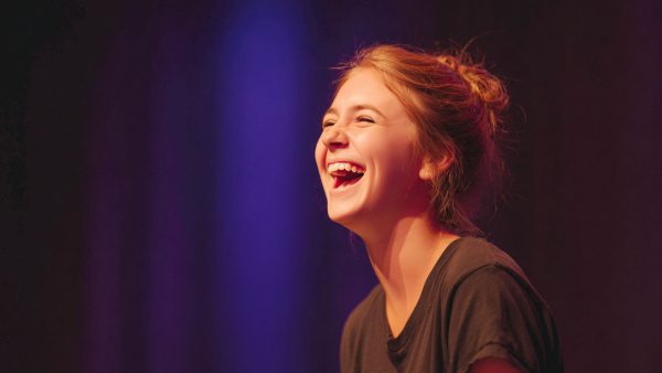 Teen girl performing a comedic monologue, expressive and playful, ideal for auditions or drama class.