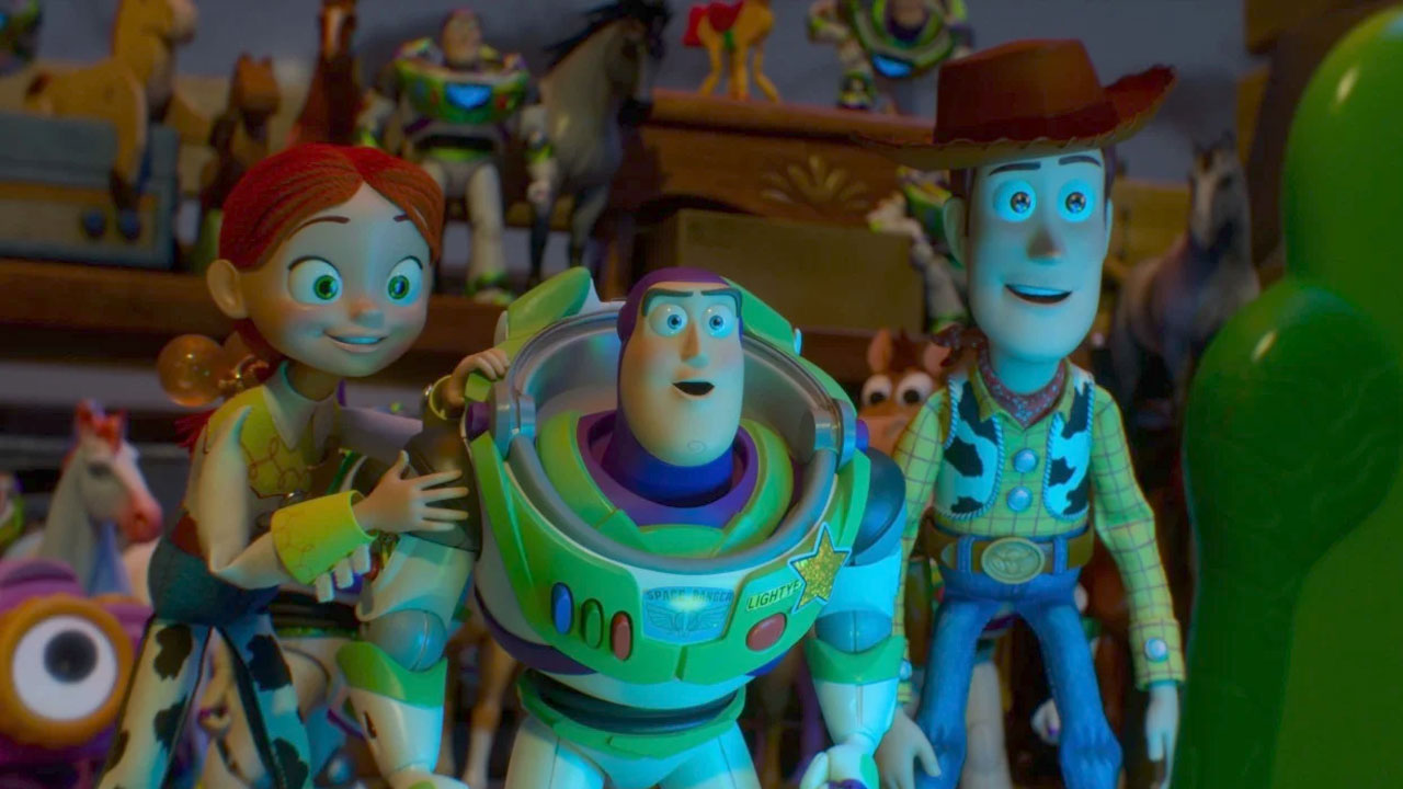 Jessie, Woody and Buzz look on in a scener from Toy Story 5