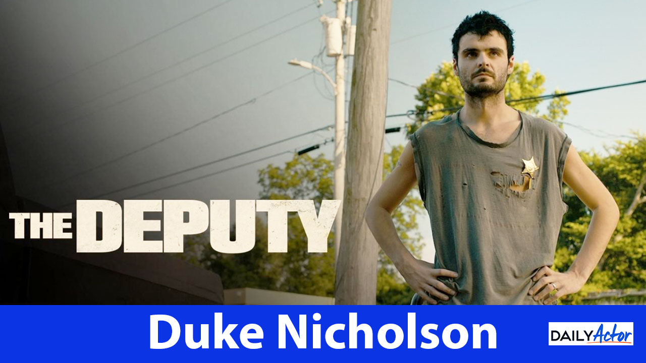 Duke Nicholson as Toby Sawyer stands with his hands on his hips in a promotional image for The Deputy.