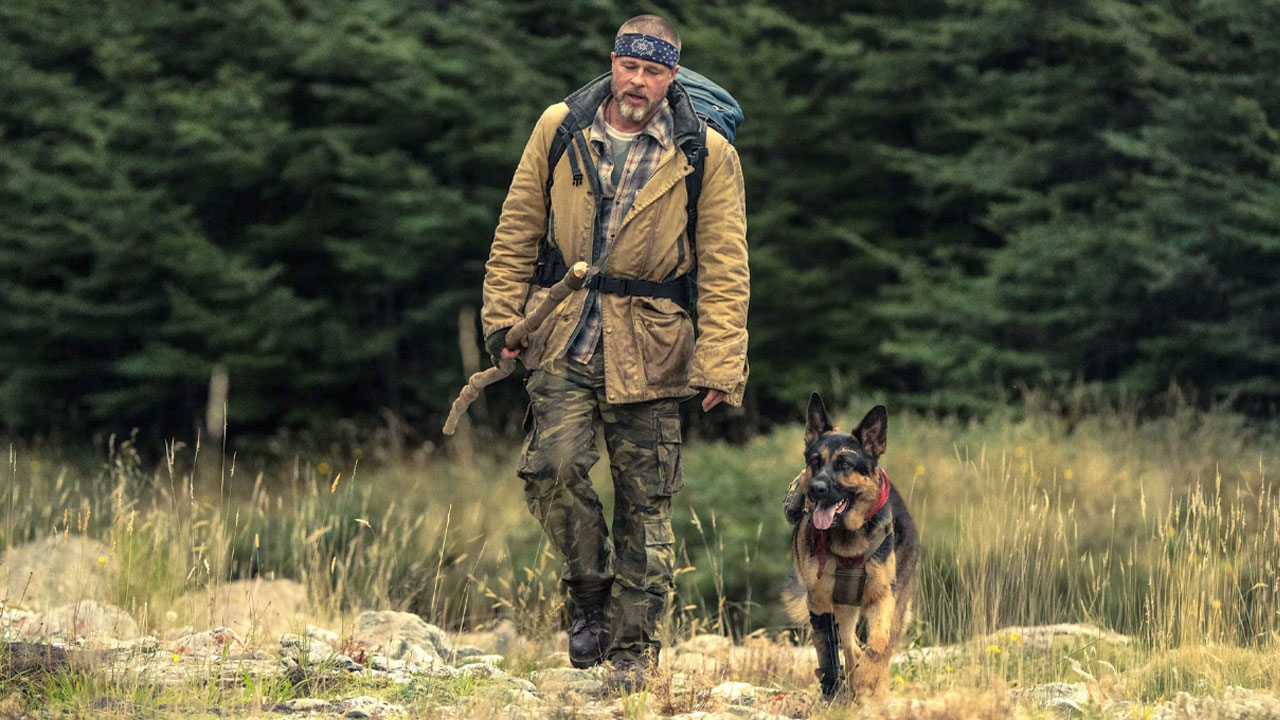 Brad Pitt and Uber the dog walking in the Alaskan wilderness in Heart of the Beast